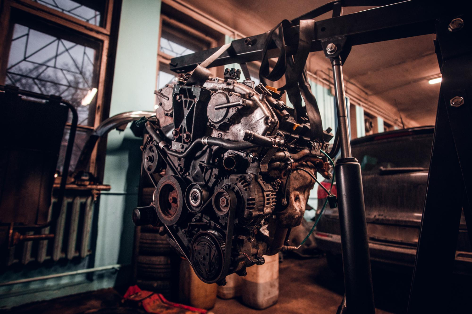 female-model-with-tattooed-body-wearing-protective-goggles-car-engine